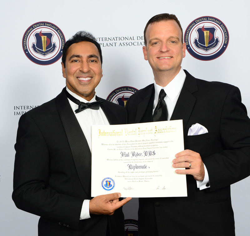 Dr. Rider receving his Diplomate Certificate from Dr. Garg
